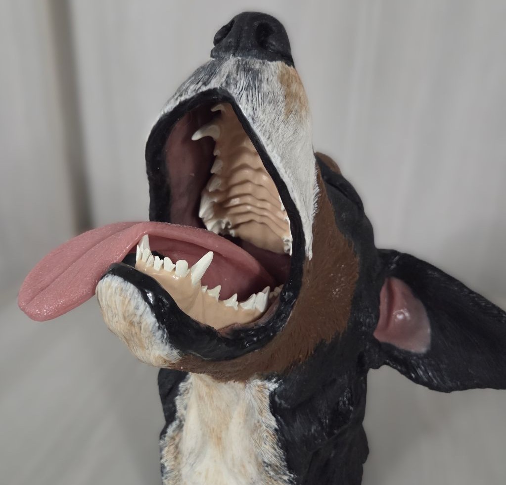 Front view of Max, the canine dental simulation head, with mouth open showing teeth, tongue and palate